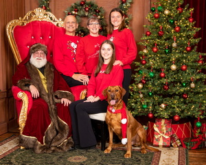 Family and dog with Santa